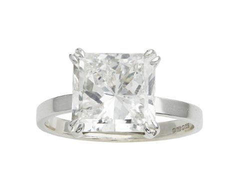 A single stone diamond set ring  claw set with a single princess cut diamond, to a plain unmarked white metal shank; with acc