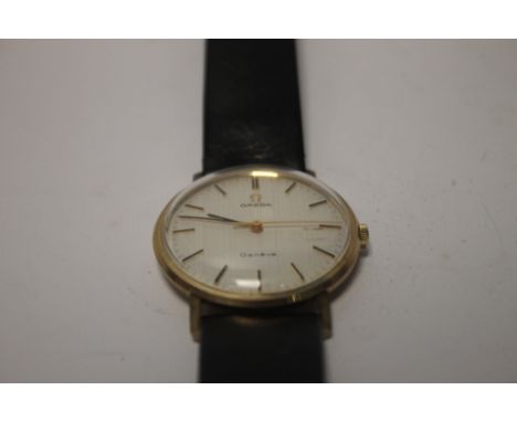 A GENTLEMANS 9CT GOLD OMEGA WRISTWATCH WITH INSCRIPTIONA couple of light surface scratches to the glass and rubbing to the ba