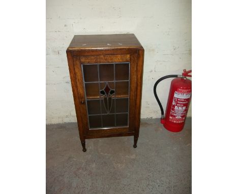 A VINTAGE OAK LEADED SIDE CABINET