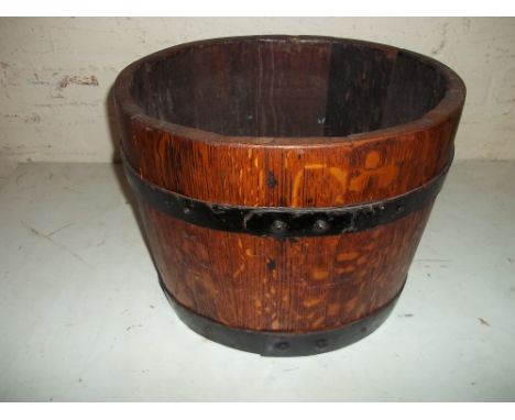 A HALF WHISKEY BARREL PLANTER