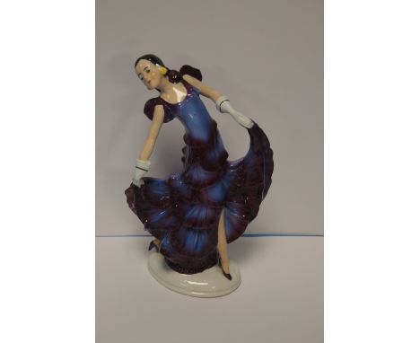 A CERAMIC FIGURINE 