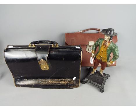 A cast figurine depicting and early New Englander and two vintage satchels / bags. [3]