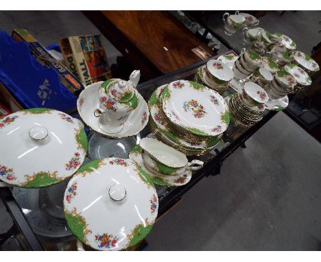 A large collection of Paragon China dinner and tea ware in the 'Rockingham' pattern, approximately 100 pieces.Condition Repor