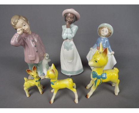 Three Nao figurines, the largest approximately 20.5 cm (h) and three Babycham deer style figurines. [6]Condition Report: Nao 