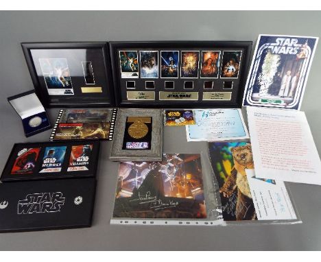 Star Wars - A collection of Star Wars related items including limited edition film cell montages, medallions, playing cards, 