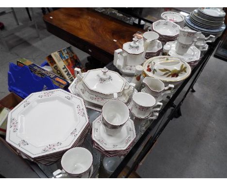 A quantity of Johnson Brothers dinner and tea wares, of octagonal form and decorated with stylised pink flowers, approximatel