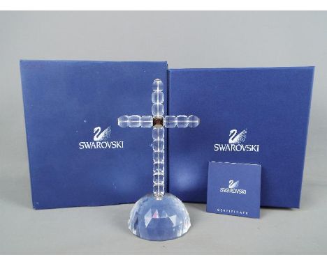 Swarovski - A Swarovski Crystal 'Cross of Light', contained in original box with outer card sleeve.Condition Report: Appears 