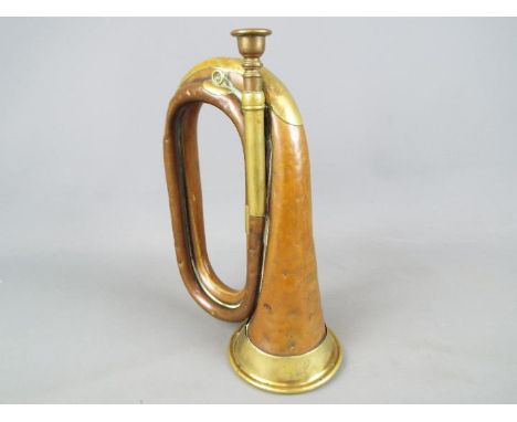 An early 20th century brass mounted, copper bugle.