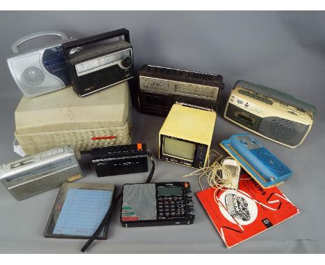A collection of vintage radios, a vintage portable television and a Philips four track tape recorder. [2]