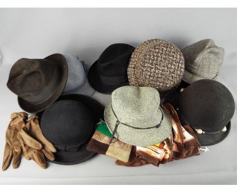 A mixed lot of vintage hats and gloves. 