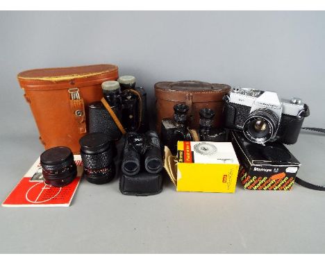 A vintage Mamiya / Sekor 500TL, two additional Carl Zeiss Jena lenses, two cased pairs of binoculars.