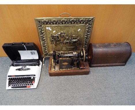 A vintage Singer sewing machine in case, cased Brother typewriter and brass bound fire screen. [3]