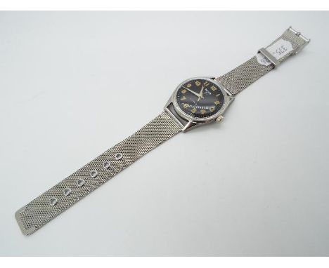 A military style wristwatch, black dial with orange numerals marked hmt,manual wind 17 jewel movement, screw back, mounted on
