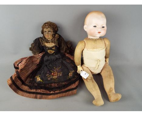 An Armand Marseille porcelain headed doll with sleeping blue eyes, stuffed body and composition hands, head marked A.M. Germa