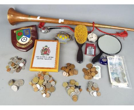 A mixed lot of collectables comprising automobilia related items to include a vintage Morris Minor hood ornament, ebony dress