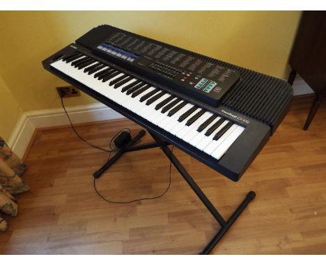 A Casio Tonebank CT-670 electronic keyboard with adjustable stand 