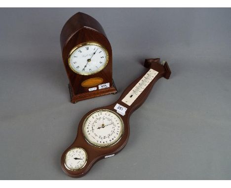 A modern Knight &amp; Gibbins lancet top mantel clock and a wall barometer. [2]