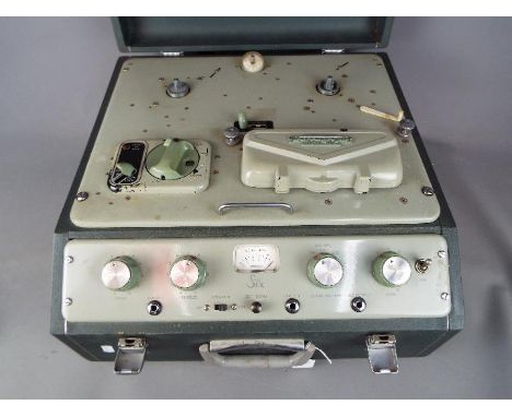 A Ferrograph Series 6, mono, half track, two head, reel to reel recorder in carry case.