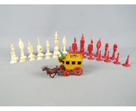 A quantity of 19th century intricately worked ivory chess pieces, King approximately 9.5 cm (h) and a Crescent Toys 'Ye Olde 