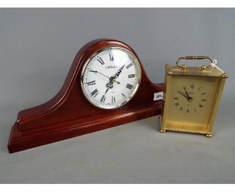 A Napoleon's hat style Windsor mantel clock and an Acctim carriage clock. [2]
