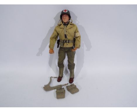 Dragon - An unboxed Dragon 12" action figure of a WW2 US Army Medic. The figure is stamped 'Dragon Models' to rear, with the 