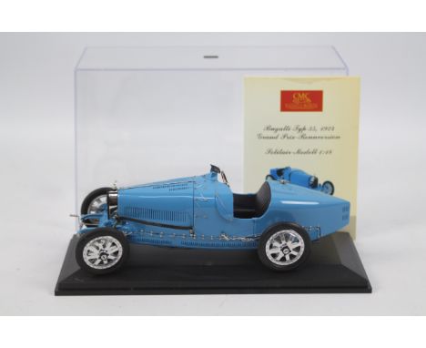 CMC- a 1:18 scale precision model of a Bugatti type 35 1924 Grand Prix race car, finished in blue, bonnet opens to reveal eng