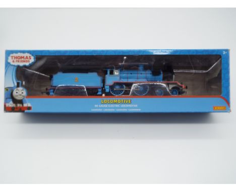 Hornby Thomas and Friends - an OO gauge model 4-4-0 locomotive and tender, 'Edward the Blue Engine' label on box indicates DC