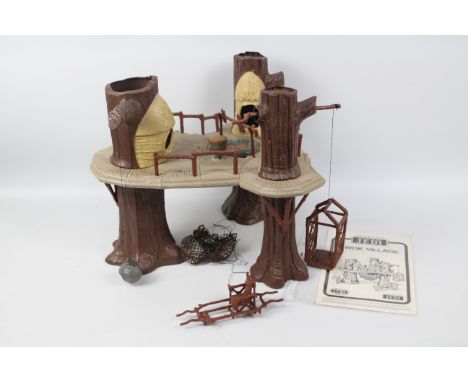 Star Wars - An unboxed Ewok Village dated 1983 with its instruction sheet and some accessories. The item appears in Very Good