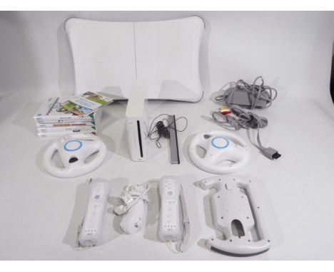 Nintendo - An unboxed Nintendo Wii console and Wii accessories to include two controllers, three steering wheels, 1 x nunchuc