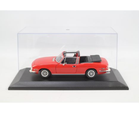 Jadi Modelcraft - a 1:12 scale precision model of a Triumph Stag, red, in a transparent display case, appears mint or near mi