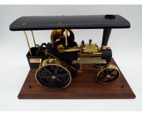 Wilesco Traktor - a live steam traction engine finished in black with brass detailing. Approx 28 cm (length), appears mint in