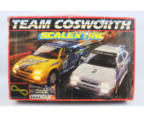 Scalextric - A boxed Scalextric Team Cosworth set # C814. The contents appear in Fair to Good condition with both Escort Cosw