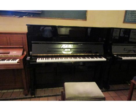 Steinway (c1995) 
A Model K upright piano in a bright ebonised case, together with a stool. 