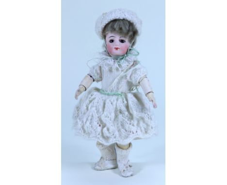 A small Francois Gaultier bisque head doll, size 1, French circa 1890, pale bisque head with fixed brown glass eyes, single s