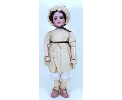 A S.F.B.J 60 bisque head girl doll, French circa 1905, with weighted brown glass eyes, open mouth with upper teeth and painte