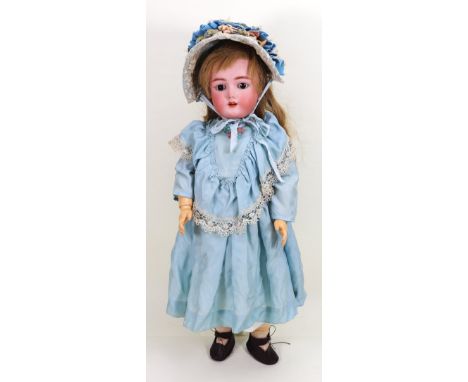 A Heinrich Handwerck/S&H bisque head girl doll, German circa 1905, with weighted brown glass eyes, raised eyebrows, open mout