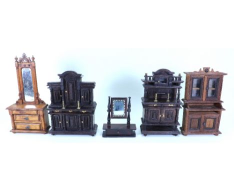 Wooden miniature furniture, including stained dark wooden Tudor style sideboard with opening doors, carved pillars and pedime