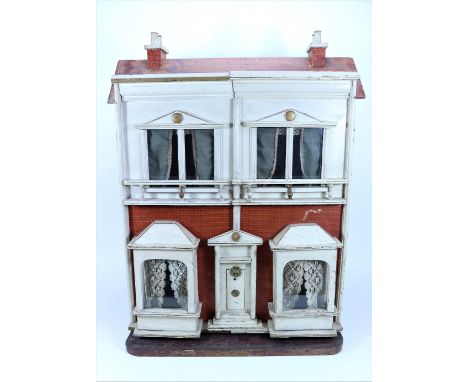 A G & J Lines No: 20 painted wooden dolls house, English 1909-10, the painted white and red brick effect papered exterior, wi