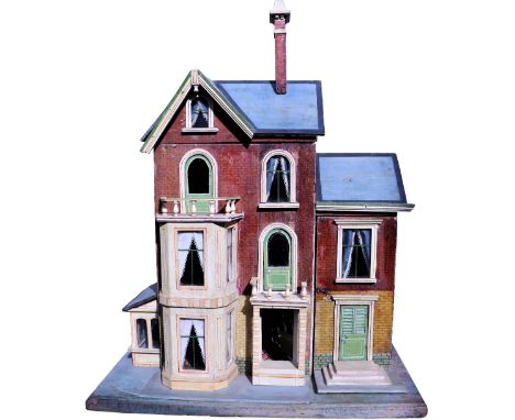 A Moritz Gottschalk blue roof dolls house with Garden room, German circa 1905, the paper brick effect exterior, standing on a