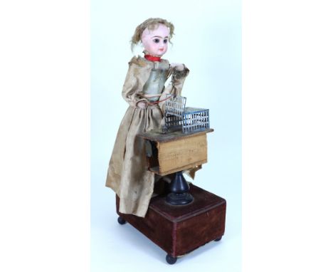 A Renou Little Girl with Mouse Automata, French circa 1900, the Jumeau bisque head (incised M) with closed mouth, blue paperw