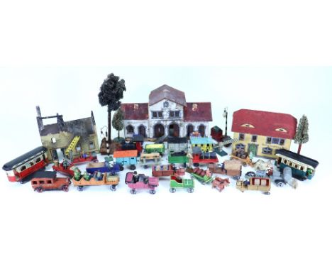 Collection of Erzgebirge buildings, trains and motor vehicles, 1920s, including three wooden painted buildings Railway Statio