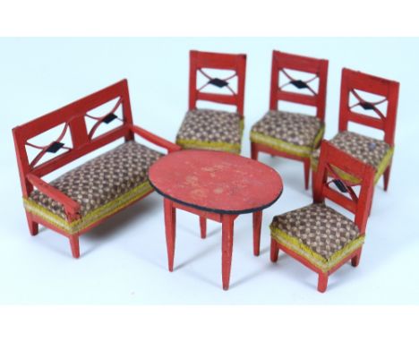 Suite of red painted Empire style wooden chairs and table, German mid 19th century, four chairs and sofa all with brown patte