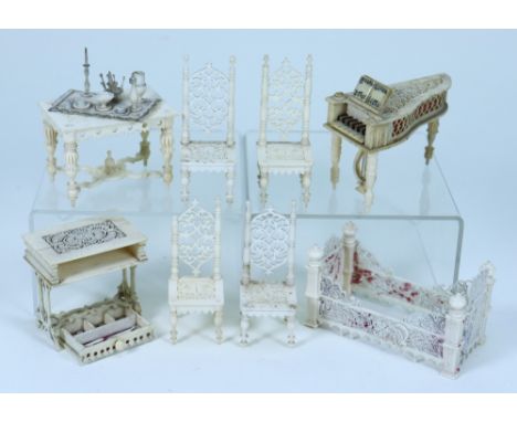 Set of carved bone dolls house furniture, mid 19th century, all with fine pierced fretwork including set of four chairs with 