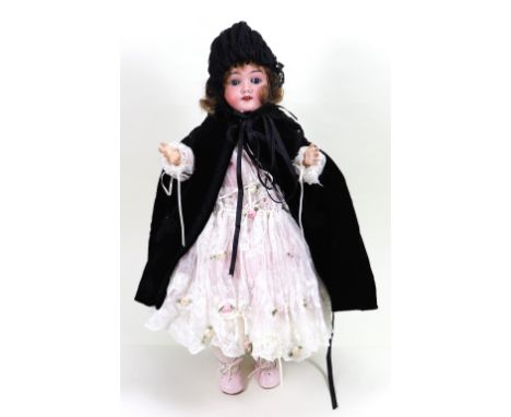 A Max Heinrich Handwerck 283 bisque head girl doll, German circa 1905, with weighted blue glass eyes, open mouth with upper t