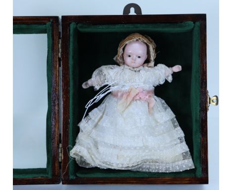 A very sweet small Sonneberg Taufling ‘Motschmann’  papier-mache baby doll, German circa 1860, with glass eyes, painted mouth