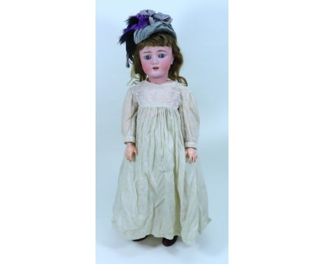 A Handwerck/Halbig bisque head girl doll, German circa 1905, with weighted blue glass eyes, raised eyebrows, open mouth with 