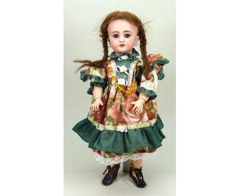 A DEP bisque head doll, German for French market, circa 1905, with weighted blue glass eyes, raised brows, open mouth with up