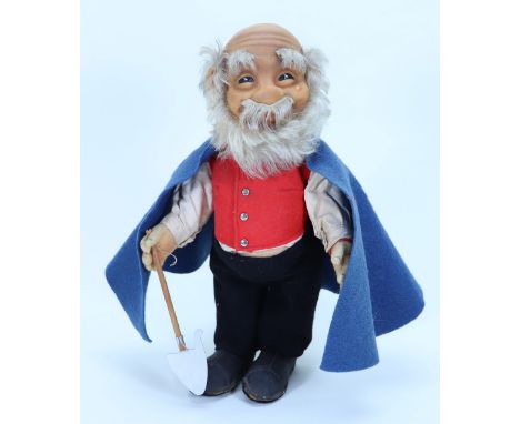 A Steiff Shepherd doll in original clothes, German 1950s, the rubber grinning face with painted dark eyes, grey mohair beard,
