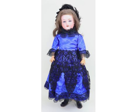 An Armand Marseille mould 390 bisque head girl doll, German circa 1905, with weighted blue glass eyes, open mouth with upper 