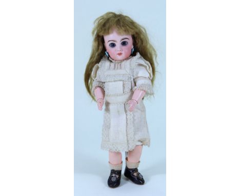 A small Tete Jumeau bisque head Bebe doll, size 2, French 1890, with fixed blue glass paper-weight eyes, finely painted lashe